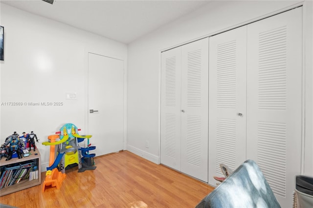 playroom featuring hardwood / wood-style floors