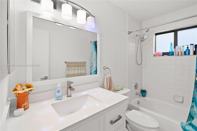 full bathroom featuring vanity, shower / bath combination with curtain, and toilet