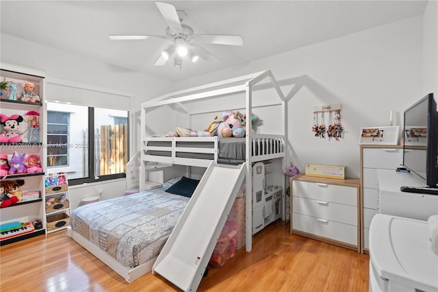 bedroom featuring ceiling fan and light hardwood / wood-style floors