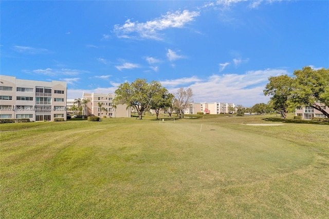 view of property's community featuring a lawn