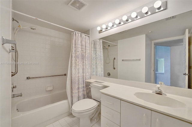 full bathroom featuring tile patterned floors, vanity, toilet, and shower / tub combo