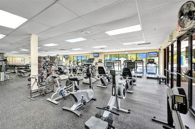 exercise room with a paneled ceiling