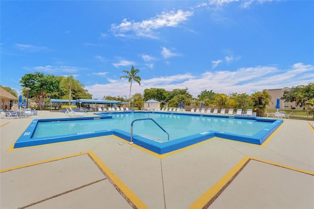 view of swimming pool with a patio area