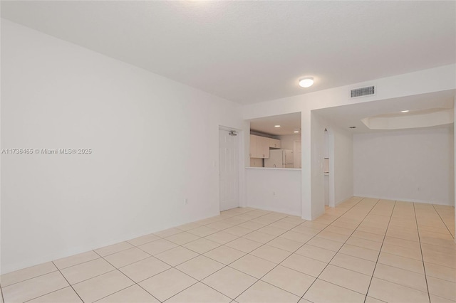 empty room with light tile patterned flooring