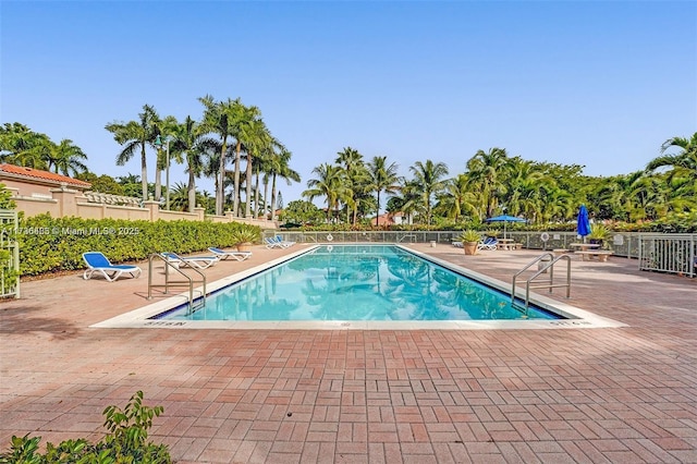 view of swimming pool with a patio area