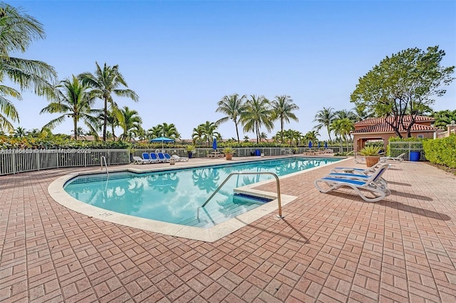 view of swimming pool with a patio