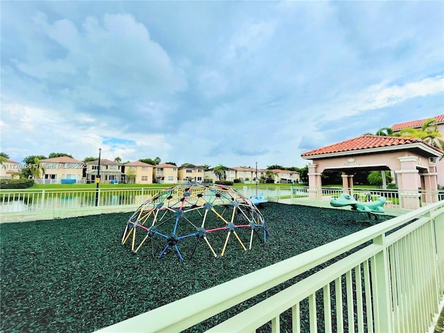 view of jungle gym with a gazebo and a water view