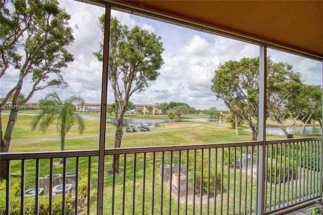 unfurnished sunroom featuring a water view and a wealth of natural light