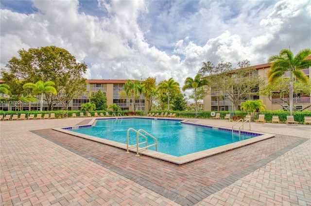 view of pool featuring a patio