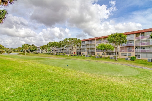 view of home's community featuring a lawn