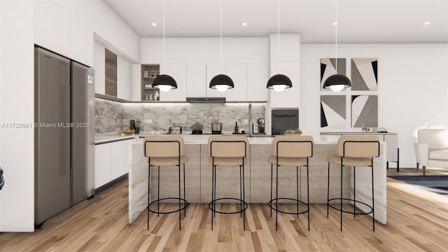 kitchen featuring modern cabinets, backsplash, freestanding refrigerator, white cabinets, and light countertops