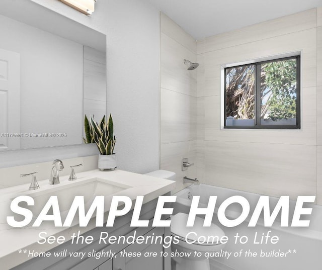 bathroom featuring tiled shower / bath combo and vanity