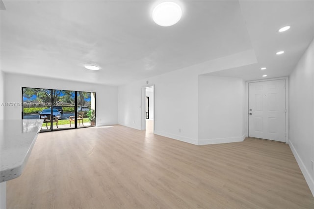 unfurnished living room featuring light hardwood / wood-style flooring