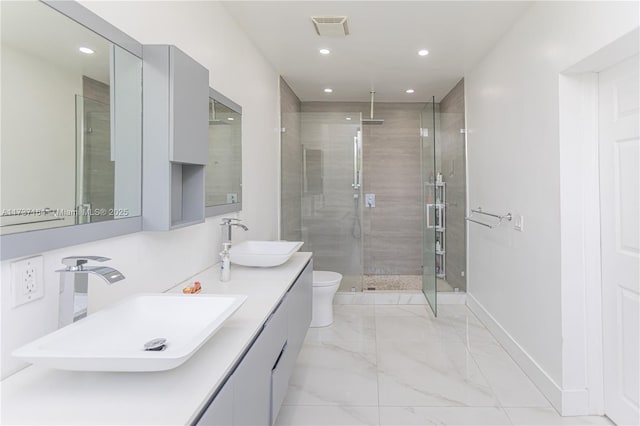 bathroom featuring walk in shower, vanity, and toilet