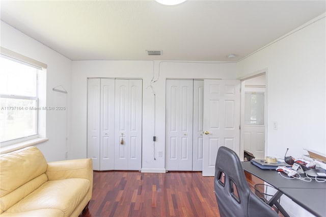 office with dark wood-type flooring