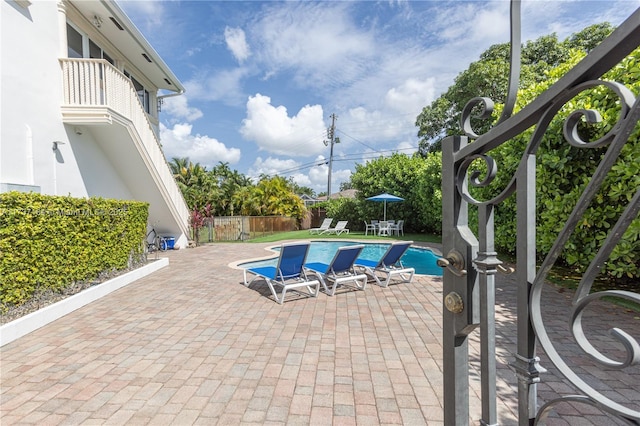 view of pool featuring a patio area