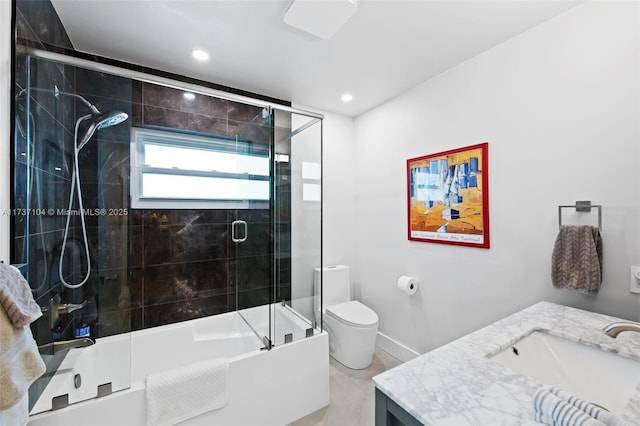 full bathroom with vanity, toilet, and combined bath / shower with glass door