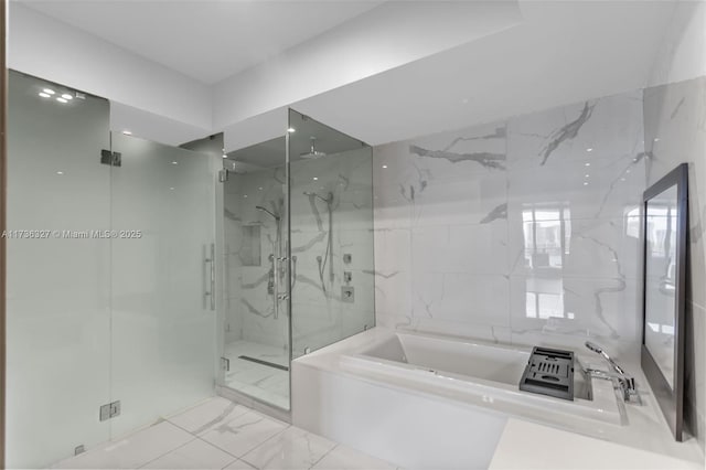 bathroom featuring tile walls and plus walk in shower