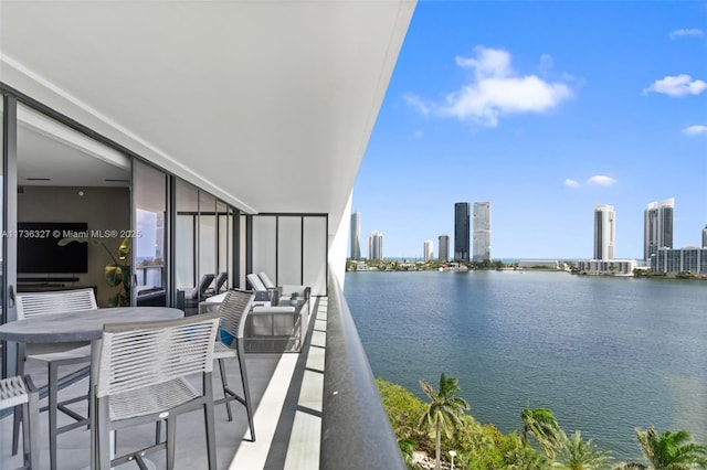 balcony featuring a water view