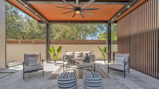 view of patio / terrace with an outdoor living space and ceiling fan