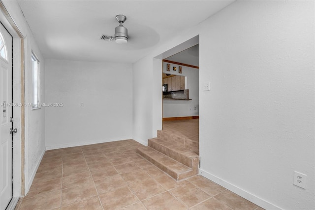 hall with light tile patterned floors