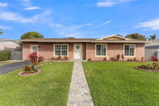 ranch-style home with a front yard