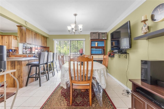 tiled dining space featuring crown molding, sink, and a notable chandelier