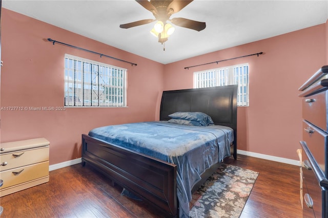 bedroom featuring dark hardwood / wood-style floors and ceiling fan