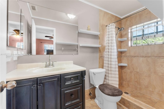 bathroom featuring toilet, vanity, ceiling fan, walk in shower, and crown molding