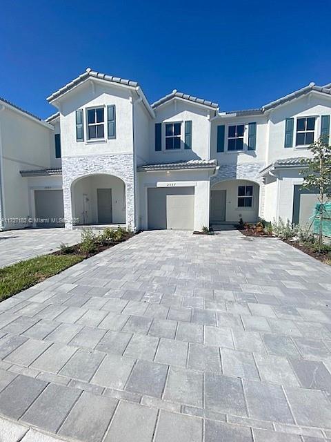 view of front of home with a garage