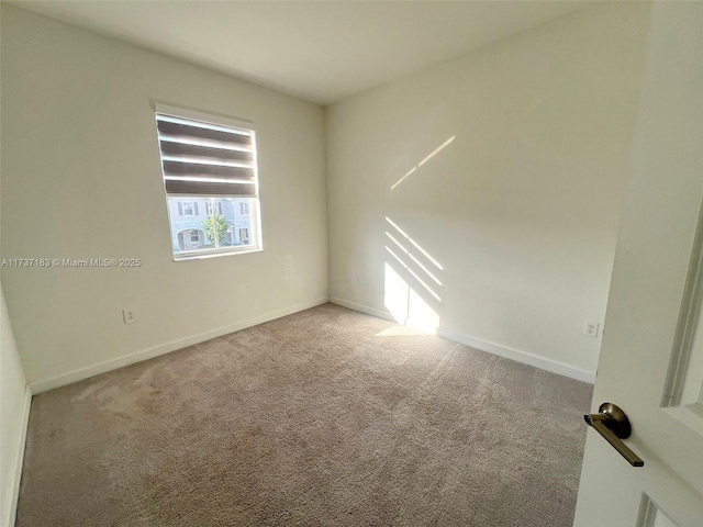 unfurnished room with light colored carpet