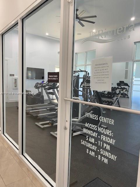 workout area with tile patterned floors