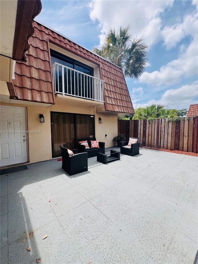529 Green Springs Pl, West Palm Beach, FL 33409 - view of patio with outdoor lounge area, a balcony, and fence