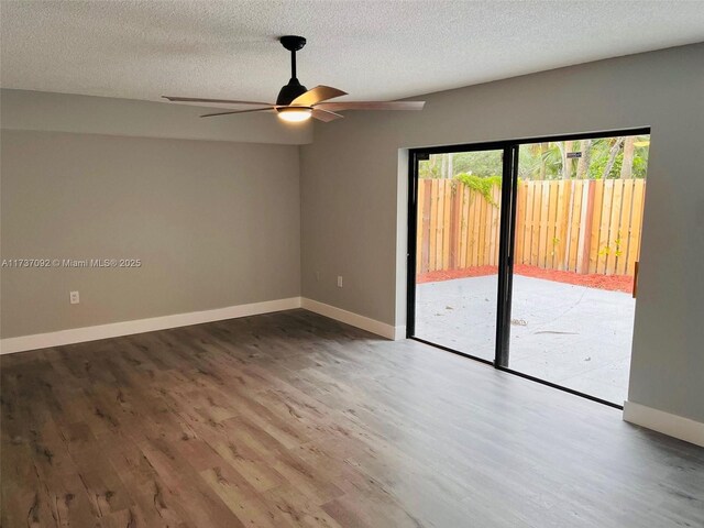529 Green Springs Pl, West Palm Beach, FL 33409 - empty room with a textured ceiling, wood finished floors, ceiling fan, and baseboards