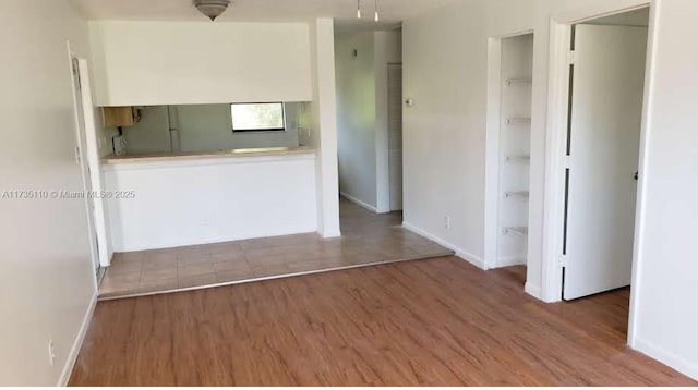 unfurnished room featuring hardwood / wood-style flooring