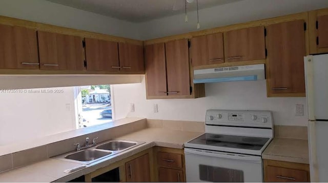 kitchen with sink and white appliances