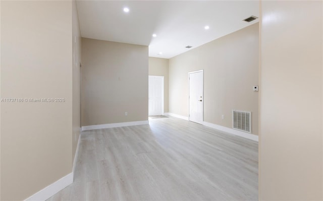 spare room featuring light wood-type flooring