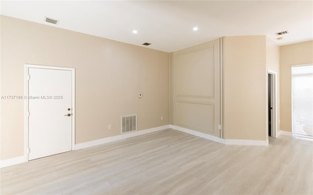 empty room with light wood-type flooring