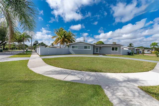 ranch-style home with a front lawn