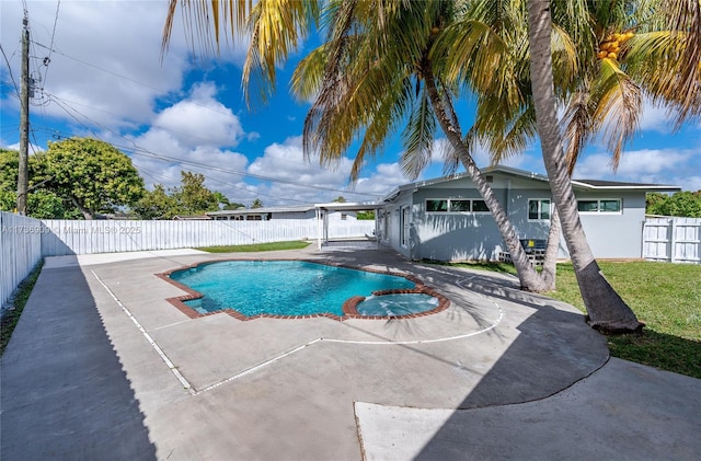 view of swimming pool with a patio area