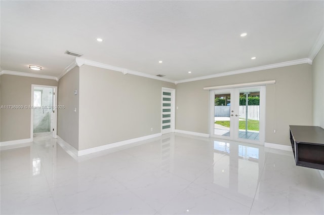 spare room featuring crown molding and french doors