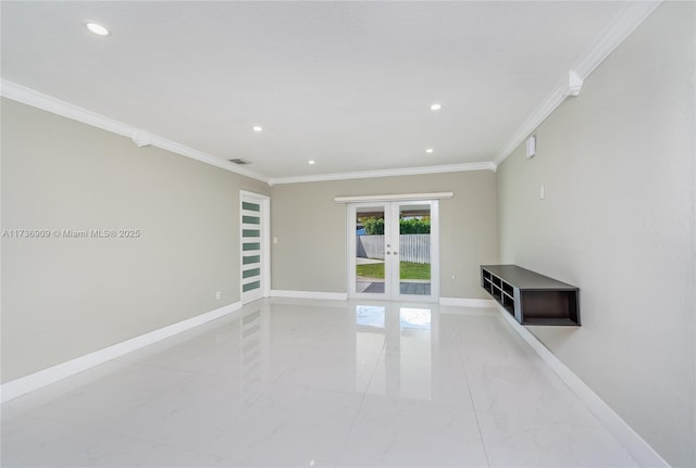 unfurnished room with ornamental molding and french doors