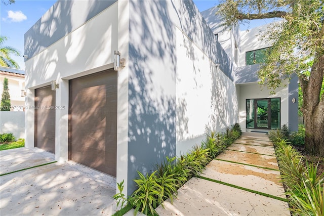 view of side of property featuring a garage