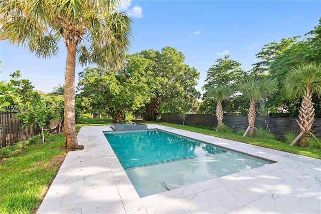 view of swimming pool featuring a patio area