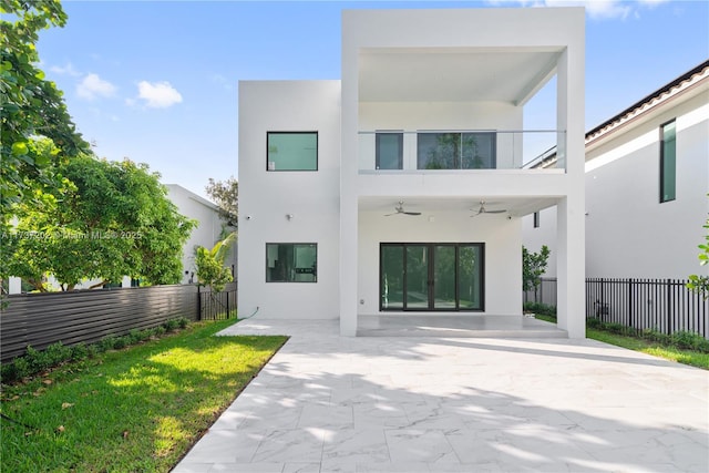 rear view of house with a patio and ceiling fan