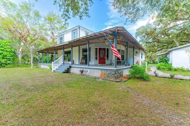 view of front of house featuring a front yard and covered porch