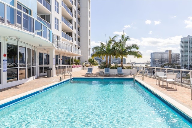 view of swimming pool with a patio area