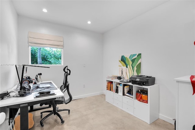 office area featuring light carpet