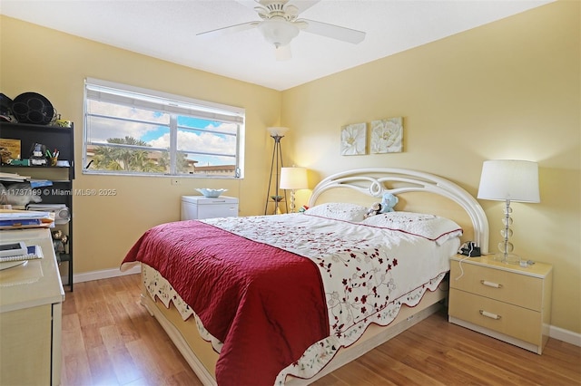 bedroom with ceiling fan and light wood-type flooring