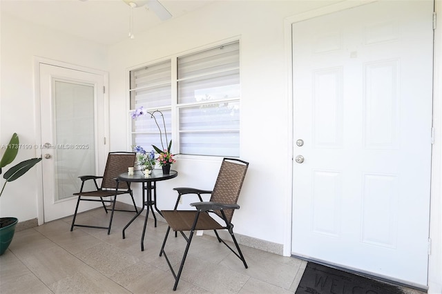 interior space featuring ceiling fan and covered porch